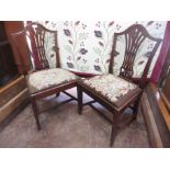 A pair of Georgian mahogany Single Chairs with pierced splats, woolwork drop-in seats on moulded