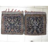 A pair of bordered Persian Saddle Bags with herati design on a blue ground, striped kelim backs, 2ft