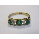 An Emerald and Diamond five stone Ring claw-set oval-cut emerald between two old-cut diamonds and