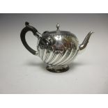 A Victorian silver globular Teapot with gadroon embossing engraved initials, London 1886