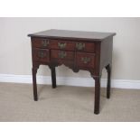 A Georgian mahogany Lowboy fitted frieze drawer and three short drawers, shaped frieze and raised on