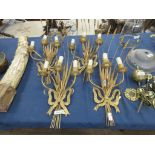 A set of four gilt metal Wall Lights with wheat ear and ribbon design