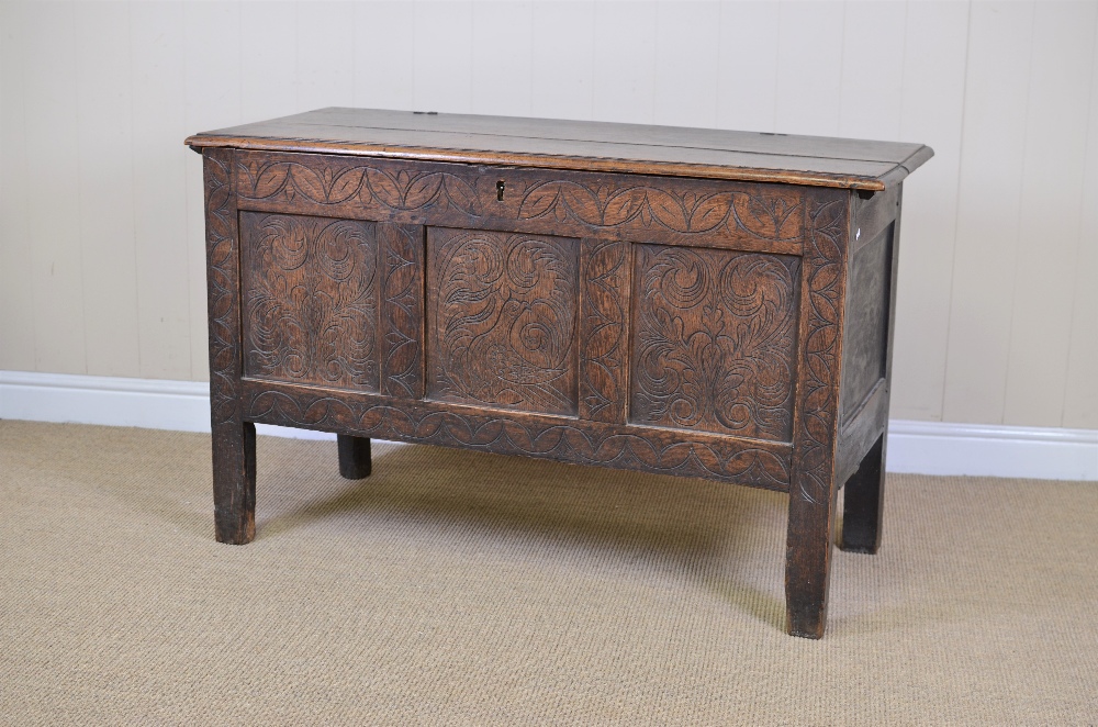 A 17th Century oak Coffer with moulded hinged top, the interior with small compartments in the one