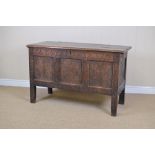 A 17th Century oak Coffer with moulded hinged top, the interior with small compartments in the one