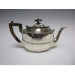 An Edward VII silver oval semi-fluted Teapot, Sheffield 1901