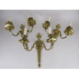 Three Regency style brass two branch Wall Lights with fluted urn surmounts, 1ft 5in H