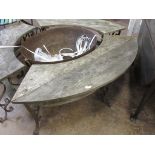 *A curved Kadai Bench on wrought iron scroll supports, 4ft 10in W (Sold plus VAT)