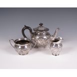 An Edward VII silver three piece Tea Service embossed scrolls and acanthus, London 1901/1902