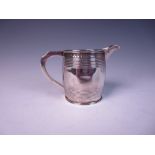 A George III silver Jug of barrel shape with reeded bands, London 1810, the later spout, London