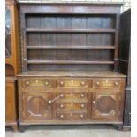 A George III oak and satinwood fan inlaid Dresser and Rack the base fitted three frieze drawers