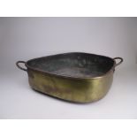 A brass Turbot Pan of shaped form with pair of carrying handles, 26in