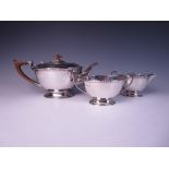 A George VI silver designer three piece Tea Service of oval form, Sheffield 1938/41, maker: Mappin &