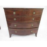 A Regency mahogany and crossbanded Bowfront Chest, fitted two short and three graduated long