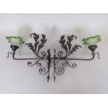 Four iron Wall Lights of leafage and scroll form with green opaque shades, 1ft 2in L