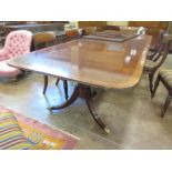 A George III style mahogany and satinwood strung D-end Dining Table mounted on twin pedestals,