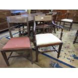 A set of eight early 19th Century mahogany Dining Chairs with cross-banded top rails, drop-in