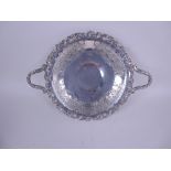 A George V silver two handled Fruit Comport with pierced and engraved fruiting vine frieze and