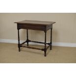 A 17th Century oak Side Table fitted single horizontally moulded frieze drawer on slender turned and
