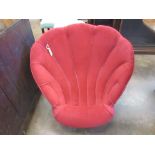 A 19th Century red upholstered shell shaped Tub Chair on turned front supports
