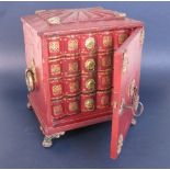 A small Regency leather covered Table Cabinet c.1820, with gilt metal mounts and paw feet, door