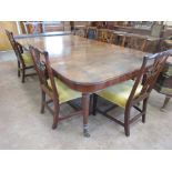 A Regency mahogany Dining Table, the shaped rectangular moulded top with four leaves above a drop