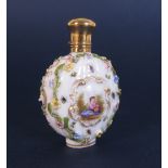 A Dresden porcelain Scent Bottle painted figure and flowers in reserves with gilt detail and