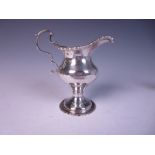 A George III silver helmet shape Cream Jug with gadroon rims on pedestal base, London 1778, maker: