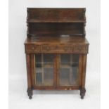 A Regency rosewood Chiffonier, the two tier stage with scrolled supports, above rectangular top