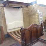 A Victorian mahogany Half Tester Bed with panelled footboard flanked by turned columns