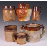 Six 19th Century stoneware Vessels, comprising a large Harvest Loving Cup with greyhound handles,