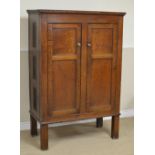 An early 19th Century Welsh oak Cheese Cupboard with pair of two panel doors, mesh panelled sides on