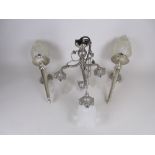 A pair of Regency style steel Wall Lights in the form of torches with opaque glass flame shades, 1ft