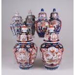 Three pairs of Japanese Imari Vases and Covers, Meiji Period, two pairs with ribbed bodies and domed