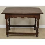 An antique oak Side Table with crossbanded three plank top above shaped frieze on turned, fluted and