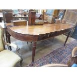 A Sheraton mahogany Serving Table, the brass gallery above a bow front string inlaid top and