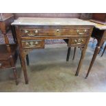 An 18th century oak Lowboy fitted one long and two short drawers, pierced corner brackets on