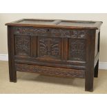 A 17th Century small oak Coffer with sunken two panel lid above tulip and rosette carved frieze