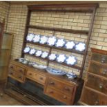 An early 19th Century South Wales oak Dresser with open rack, the base fitted five short drawers