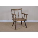 A primitive stickback Elbow Chair on turned supports