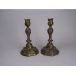A pair of 18th Century seamed brass Candlesticks with naturalistic scrolled knopped stems, 10 1/2 in