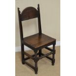 A 17th Century oak Side Chair with plain arched top rail, open back, solid seat on bobbin turned and