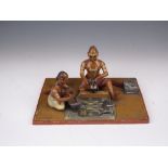 A 19th Century South Indian wood Figure Group, c. 1860, painted and varnished, of two seated