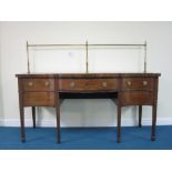 A Sheraton period mahogany Sideboard with cross-banding and satinwood stringing, the serpentine