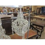 A cut glass Ceiling Electrolier of baluster form made up of interlinking crystal pendants, 1ft 8in