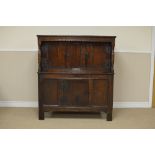 A late 17th Century oak Court Cupboard with scratch carved dentil frieze above two plank doors