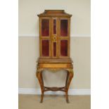 A 19th Century Louis XV style French Cabinet in kingwood etc with cross-banding, fitted two bevelled