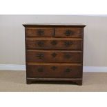 An 18th Century oak Chest of two short and three long graduated drawers on bracket supports, 3ft W