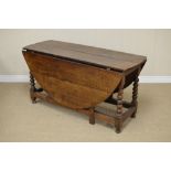 A large 18th Century oak Gateleg Table with oval top on bobbin turned supports and squared