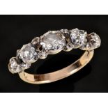 A Diamond Ring close-set five graduated old-cut stones in openwork mount with rose-cut points