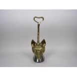 A cast brass Doorstop in the form of a fox's mask with steel weighted horse hoof base, 1ft 2in H